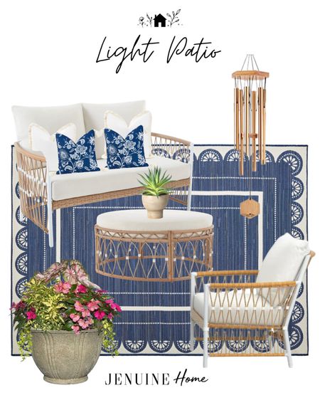 Light patio. Blue and white patio. Coastal patio. Deck seating. Neutral light outdoor sofa. White sofa. Outdoor seating. Blue and white outdoor rug. Cement planter pot. White and natural outdoor coffee table. Gold wind chimes.  Outdoor decor. Porch seating  
