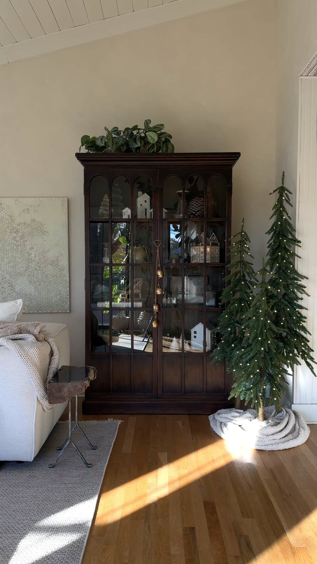 A sweet display of some of my favorite things 😌🎄❤️ most of the decor in the shelf is from previous years or vintage…except for the little wood sleigh, I bought that this year from McGee & Co! Cabinet is from @arhaus. 

#holidaydecor #christmasdecor #christmas2023 

#LTKhome #LTKHoliday #LTKSeasonal