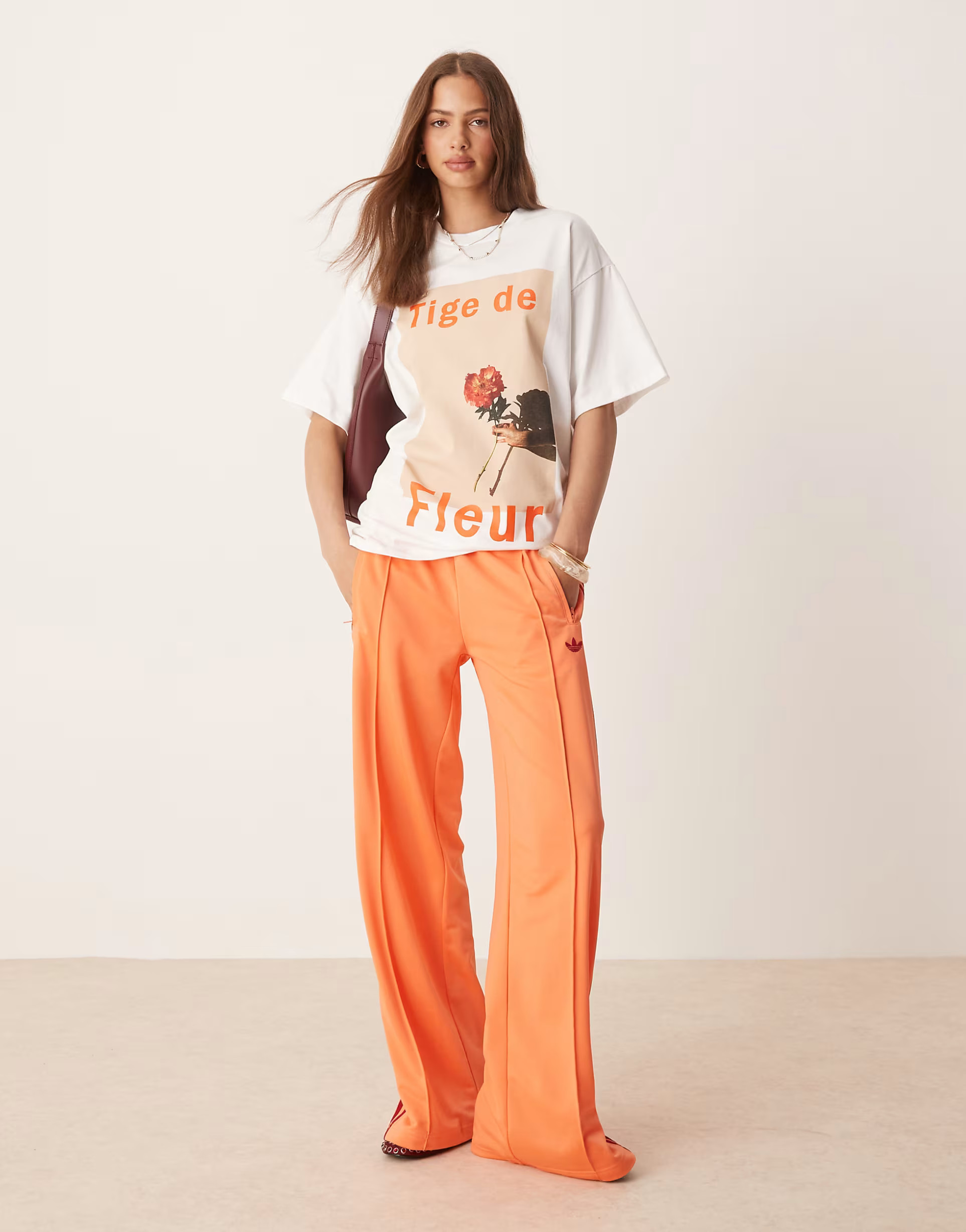 adidas Originals Firebird Loose track pants in orange | ASOS | ASOS (Global)
