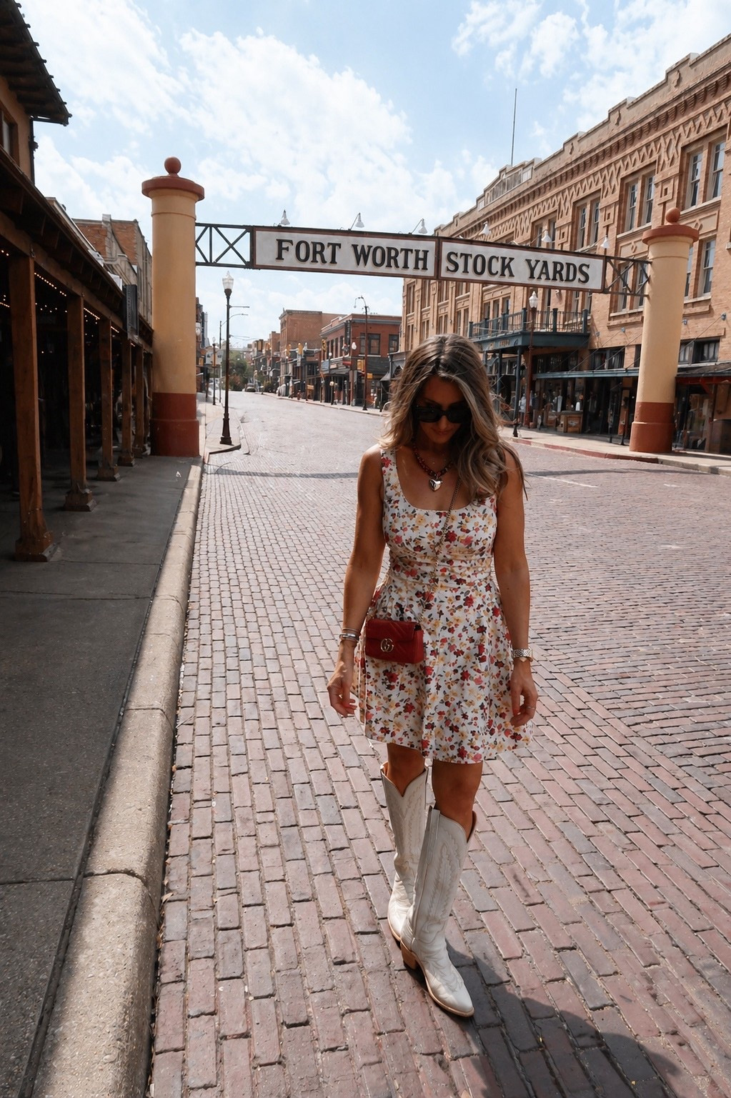 main character moment. a little floral + boots in the stockyards just feels right. easy, feminine, and a little western

fort worth stockyards, western outfit, floral dress outfit, cowboy boots style, texas outfit, themominstyle 

#LTKootd #LTKSeasonal #LTKOver40