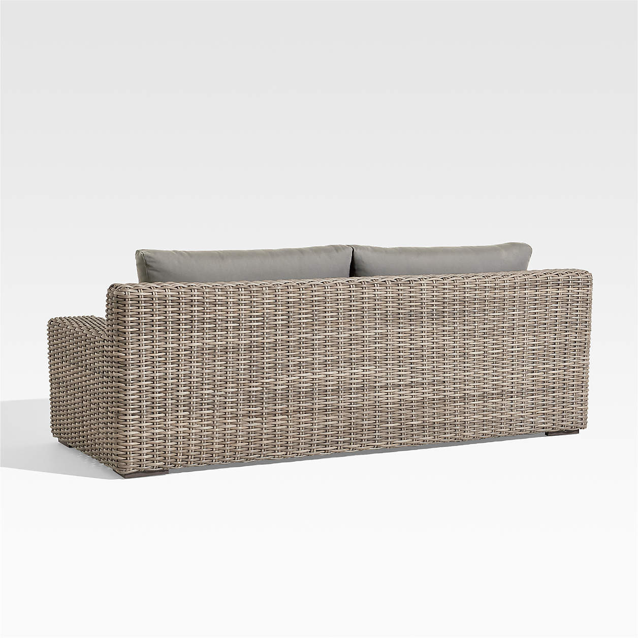Abaco All-Weather Resin Wicker Outdoor Patio Sofa with White Sunbrella Cushions + Reviews | Crate... | Crate & Barrel