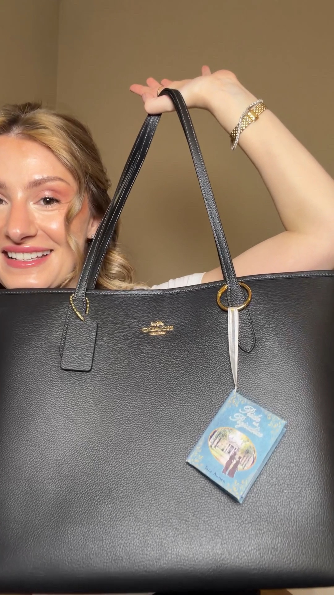 I got impatient waiting for the coach bag leather book bag charms and dug around for some book charms and found this adorable Etsy shop that sells mini book ornaments that people are turning into bag charms 😍 it looks so cute on my coach city tote and of course I had to get the Pride and Prejudice book 
