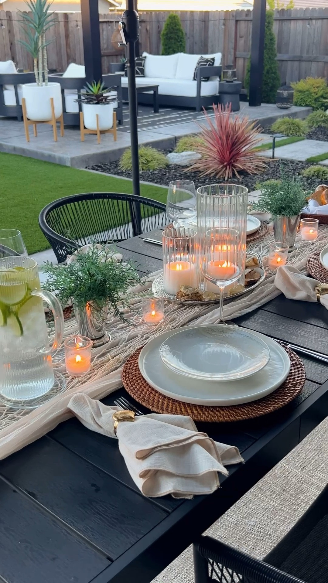 coastal table decor, summer tablescape, woven charger, rattan charger, textured salad plates, Portugal stoneware, neutral dinnerware, shell napkin rings, linen napkins, outdoor entertaining, alfresco dining, summer hosting, coastal hosting, woven pitcher, wicker wrapped pitcher, woven glassware, decorative beads, tabletop styling, neutral tablescape, entertaining essentials, modern coastal decor, summer table inspiration, hostess decor, dining table decor, layered place setting, black dining table styling, collected home decor, coastal inspired decor, candle hurricanes, textured ceramics, serving tray, decorative tray, shell dish, summer entertaining ideas, patio dining decor, elevated hosting, casual elegance.

#LTKHome #LTKSeasonal