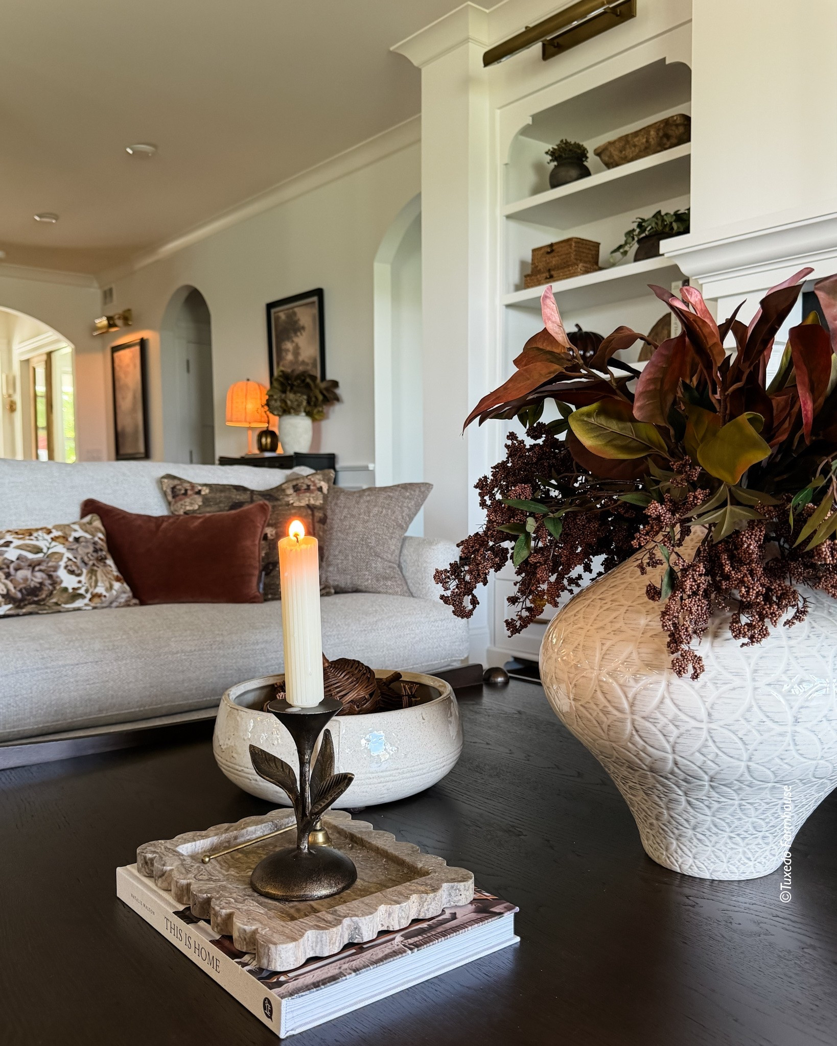 Fall coffee table styling with the prettiest magnolia and brown berry stems. I love how these rich, earthy florals add just the right touch of autumn without feeling overly seasonal. Such an easy way to bring warm fall color and texture into your home. 🍂#LTKStyleTip #FallDecor #CoffeeTableStyling #FallFlorals #MagnoliaStems #CozyFallHome

#LTKHome #LTKSeasonal #LTKSeasonal #LTKHome #LTKSaleAlert
