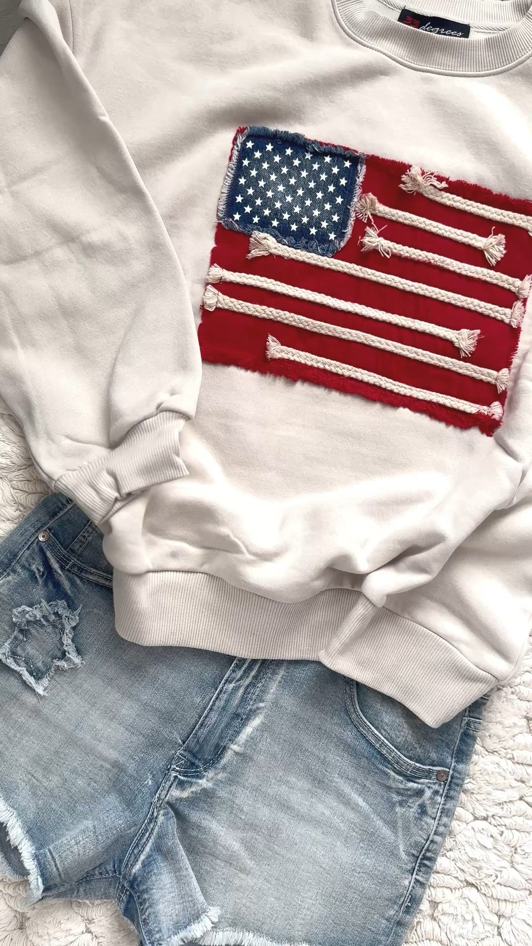 Stars, stripes, and the CUTEST cozy girl vibes 🇺🇸. This patriotic sweatshirt is giving major designer-inspired energy without the designer price tag! The vintage rope flag detail is so unique and elevated, and the oversized comfy fit makes it perfect for BBQs, lake days, fireworks, country concerts, and chilly summer nights. Paired with denim shorts for the ultimate effortless all-American look ❤️🤍💙 Grab this Free People dupe before it sells out too!

#LTKFindsUnder50 #LTKStyle #PatrioticStyle #FourthOfJulyOutfit #AmericanaStyle #CozyStyle #FreePeopleDupe #SweatshirtWeather #CasualChic #SummerStyle #RedWhiteAndBlue #OOTD #CountryConcertOutfit #LakeDayOutfit #TrendyFashion #ViralFashion #WeekendStyle #NeutralStyle #FashionFinds #CuteAndComfy #DenimShortsStyle #BoutiqueStyle #EverydayStyle #SummerOOTD #USAStyle #PatrioticOutfit #EffortlessStyle #TrendingNow #AmazonFashionFinds

Free People dupe • patriotic sweatshirt • Americana sweatshirt • USA flag sweatshirt • oversized patriotic pullover • vintage flag sweatshirt • cozy neutral sweatshirt • Fourth of July outfit • country concert outfit • casual summer outfit • patriotic fashion women • trendy oversized sweatshirt • boutique style sweatshirt • rope flag sweatshirt • comfy cute outfit • summer layering piece • denim shorts outfit • viral fashion finds • affordable Free People dupe • neutral aesthetic outfit

#LTKSeasonal #LTKootd #LTKstorytime #LTKOver40