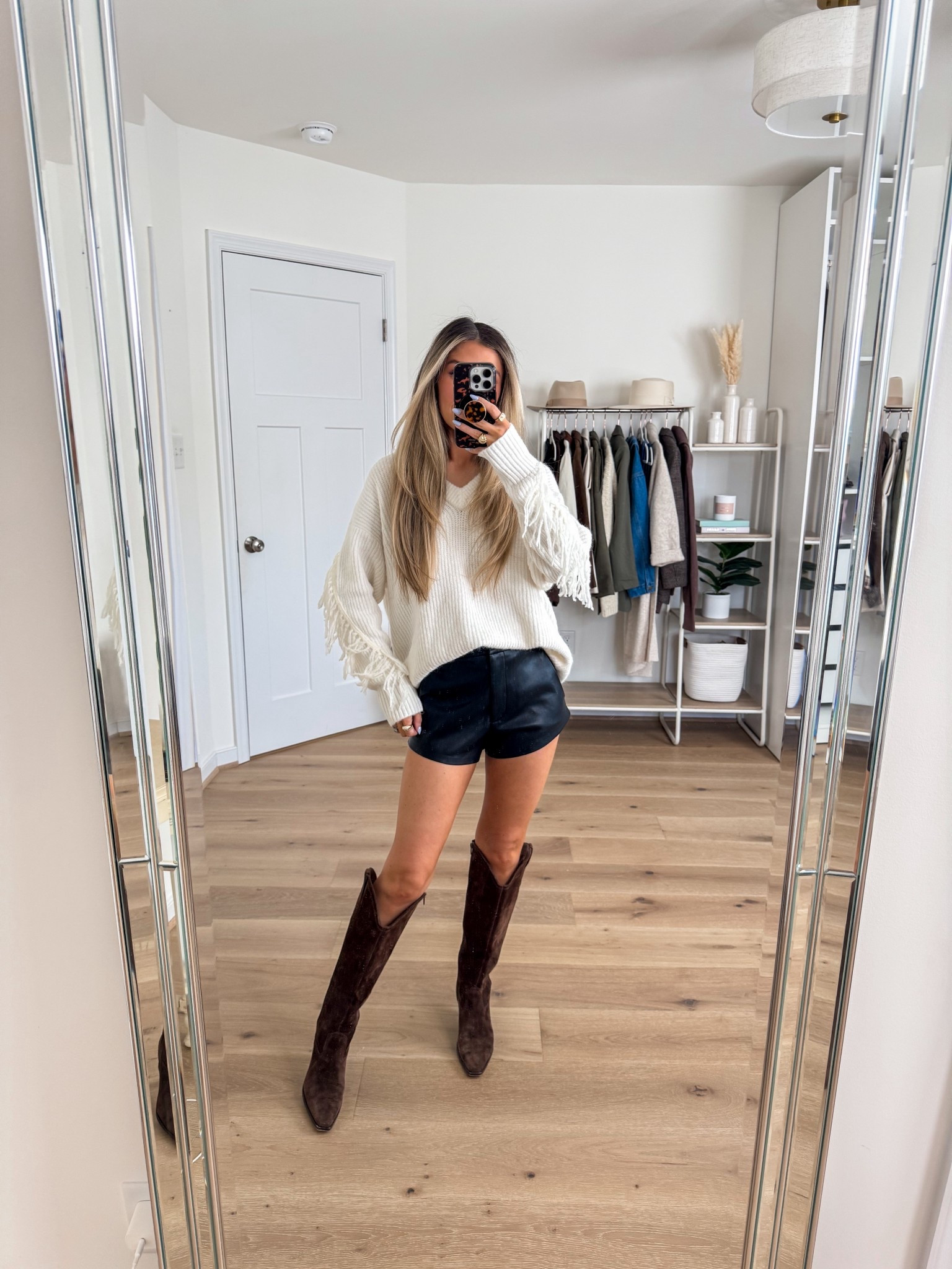 Oversized fringe sweater: xs 
Faux leather shorts: xs 
Boots: true to size 

#LTKHoliday #LTKFindsUnder100 #LTKFindsUnder50