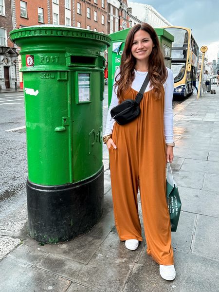 Cozy jumpsuit from amazon - has adjustable straps 
Cropped white long sleeve tshirt 
Black belt bag
White Nikes 
Dublin travel outfit 


#LTKtravel #LTKSeasonal