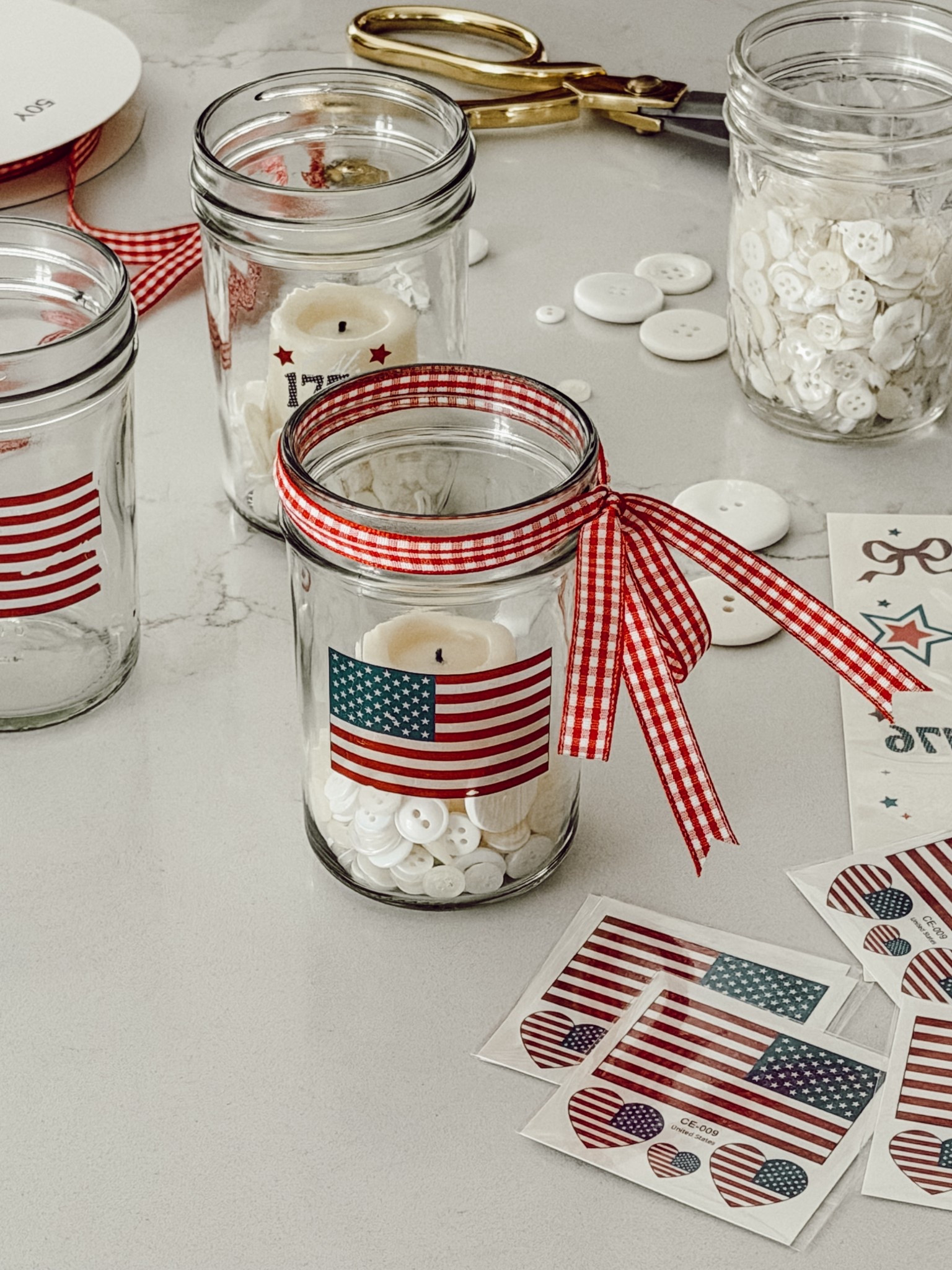 The supplies I used to make patriotic votives with temporary tattoos. 

#LTKHome #LTKSeasonal
