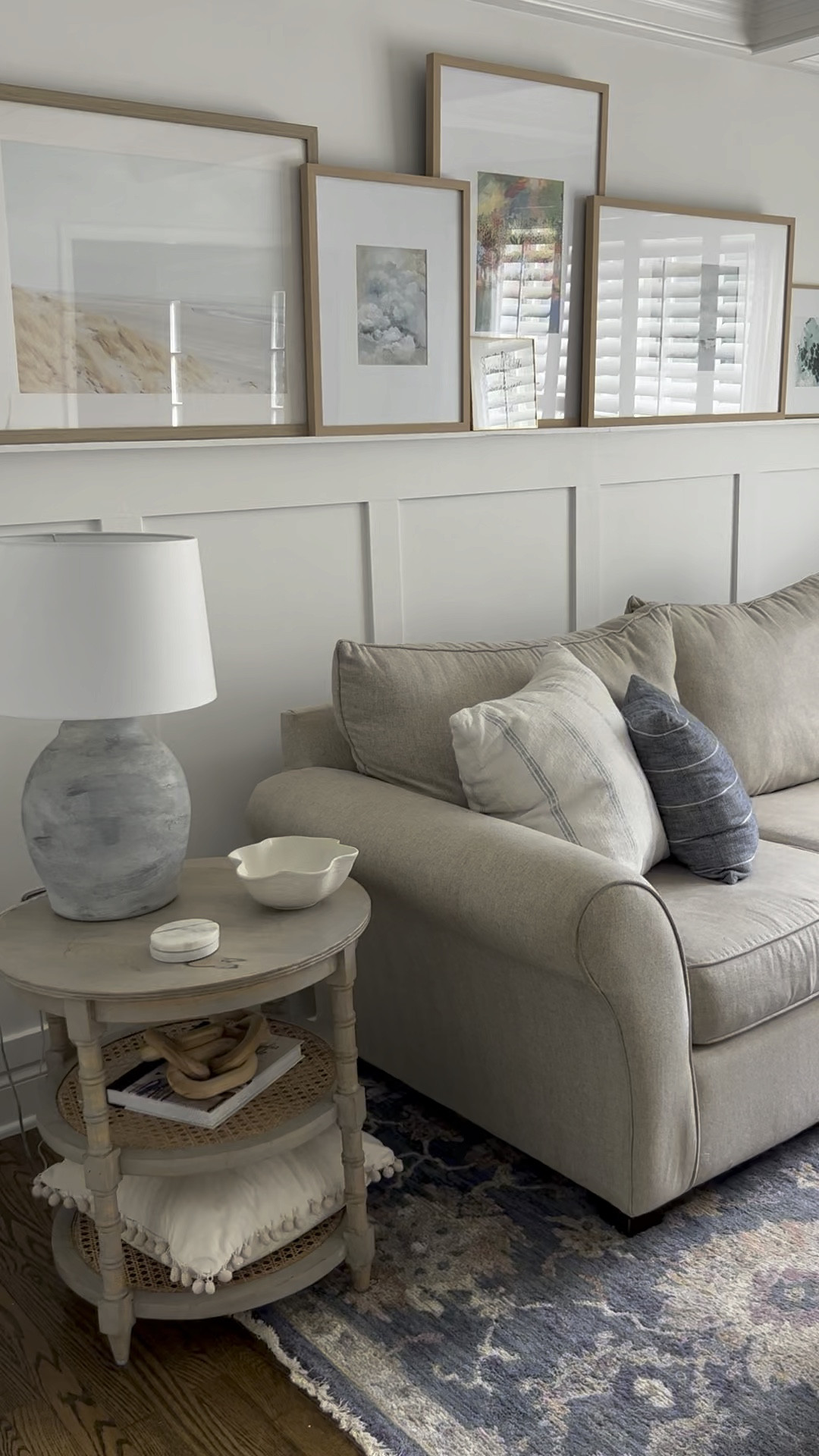 Living room decor with picture ledge gallery frames of coastal art. 

Blue area rug, living room rug, mango wood side table, round end table with cane shelf, ruffle bowl, wave bowl, Studio McGee bowl, marble coaster, natural wood gallery frame, coastal art print, framed art, wood chain link decor, throw pillow, Loloi area rug, Brass floor lamp, Studio McGee lamp, Amazon drapes, pinch pleat curtains, gold curtain rod. 

Target, Amazon.

#LTKFind #LTKstyletip #LTKhome