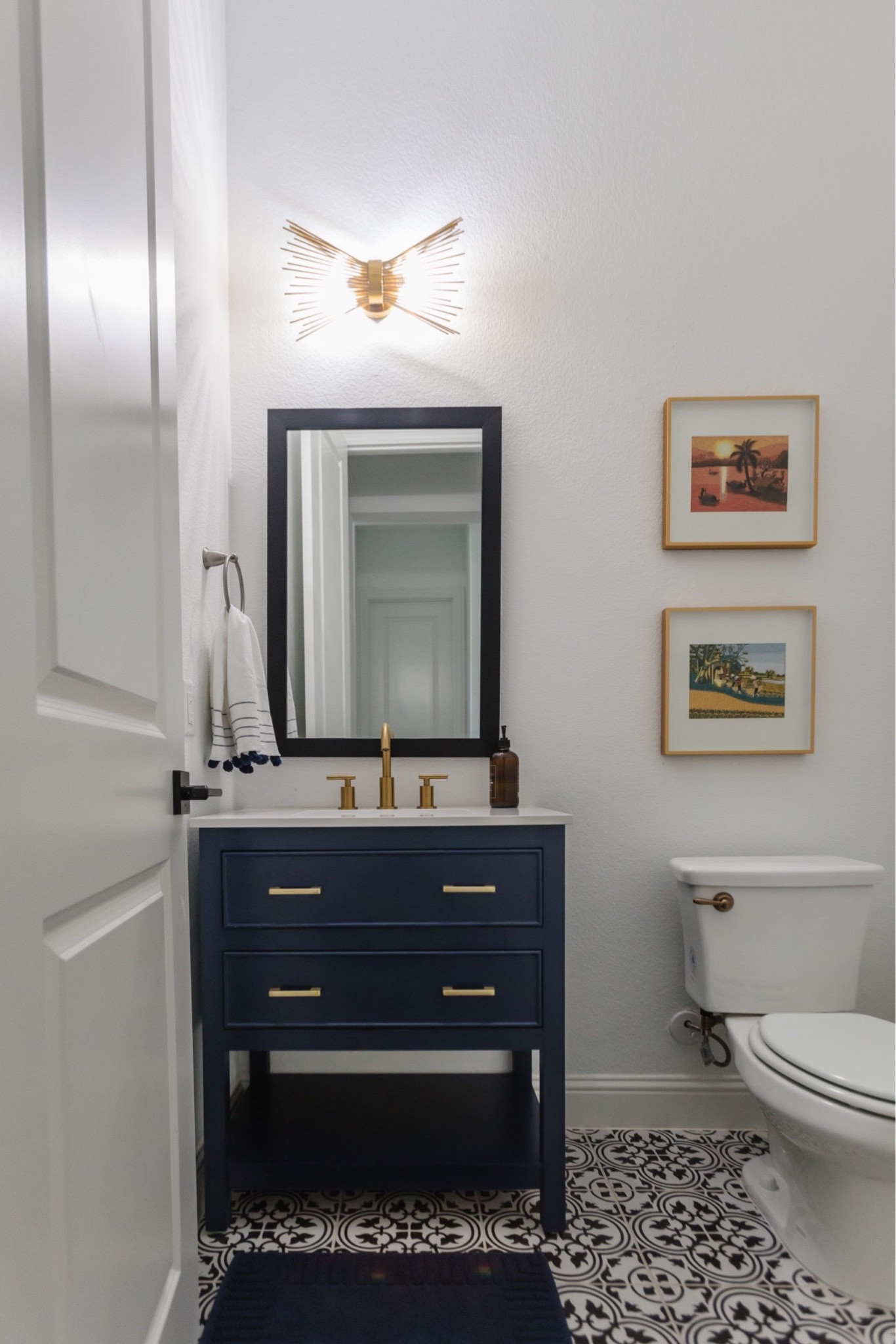 Navy blue vanity that elevated our parents powder bathroom! I appreciate that it has shelving and drawers for optimal storage. Easy to install and looks so pretty! 

#LTKhome #LTKstyletip