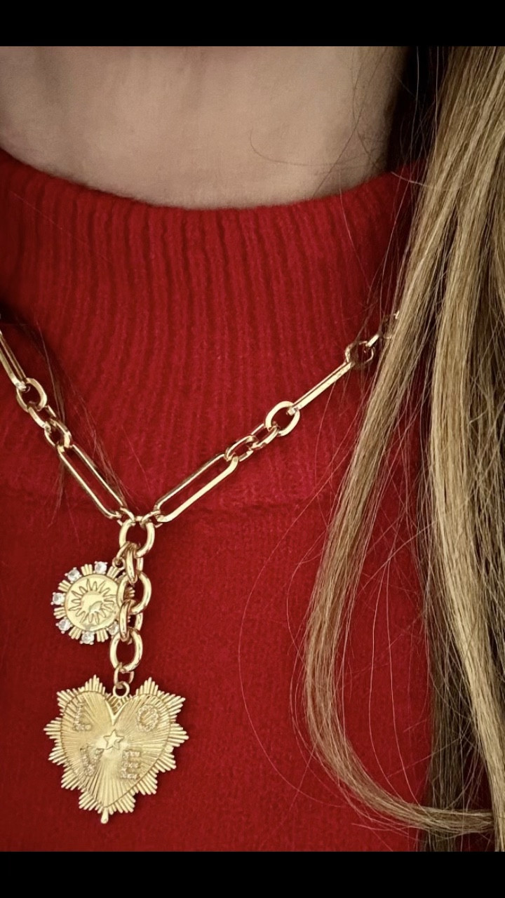 Statement necklaces are back and this super affordable paper clip chain is all the rage! The LOVE heart pendant is extra special and makes a great gift. The gold tone mixes nicely with my real gold jewelry.

#LTKFindsUnder50 #LTKHoliday #LTKGiftGuide