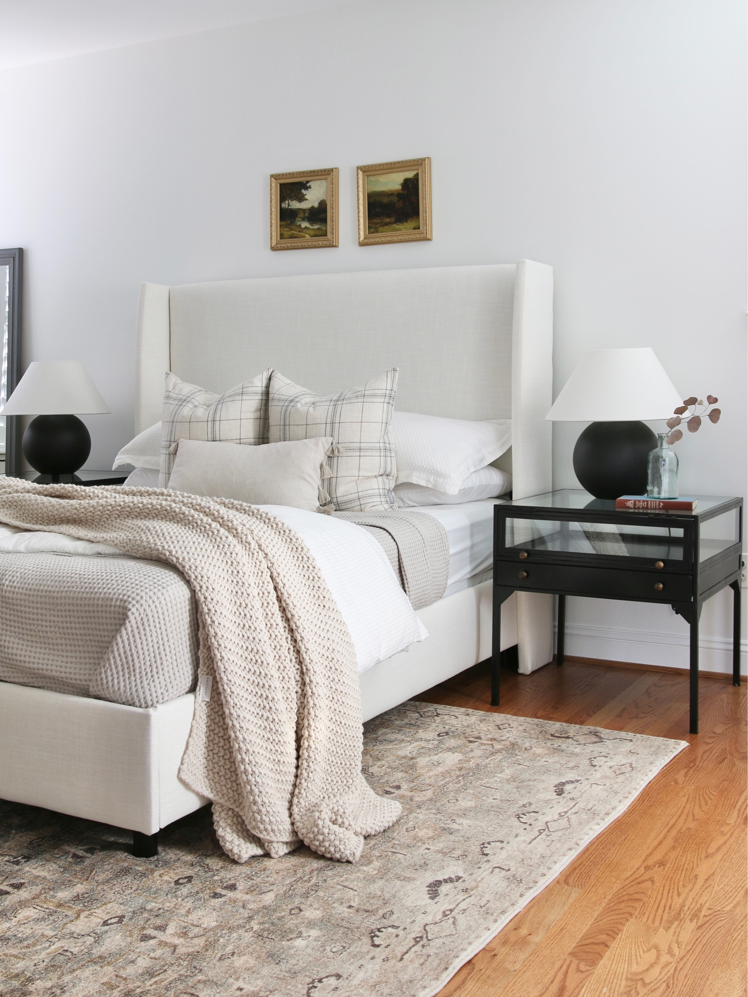 When my boys were younger they shared a room and this was our guest bedroom. Recently my younger son moved into this room and we turned my basement office into a guest bedroom. 
The centerpiece of the room is this low profile upholstered bed. I loved it so much a bought a second one to replace this when I relocated this one to the basement. On either side is a black iron and tempered glass nightstand and earthenware table lamp. 
The bedding includes plaid throw pillows and a chunky knit throw blanket 

#LTKstyletip #LTKFind #LTKhome