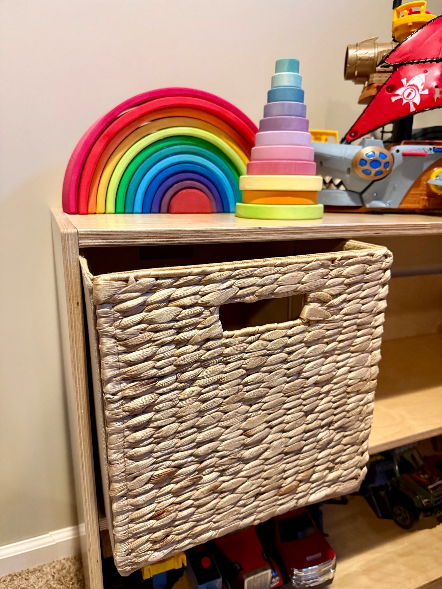 The kids’ toy shelf just got a little upgrade 🧺

I love the Montessori open-shelf, less-is-more idea… but let’s be real — it’s way easier with one kid than with three + birthdays + holidays 😅 Eventually the Hot Wheels, Legos, and Magnatiles take over and you just need a good-looking place to toss things.

This rattan cube from Better Homes & Gardens is the perfect solution. It fits right into our cube shelf, hides the chaos, and still keeps the space looking pulled together. Neutral, sturdy, collapsible, and honestly way more affordable than it looks.

Toy clutter contained = I feel slightly more together 😂

#walmartpartner

#LTKKids #LTKmomlife #LTKHome