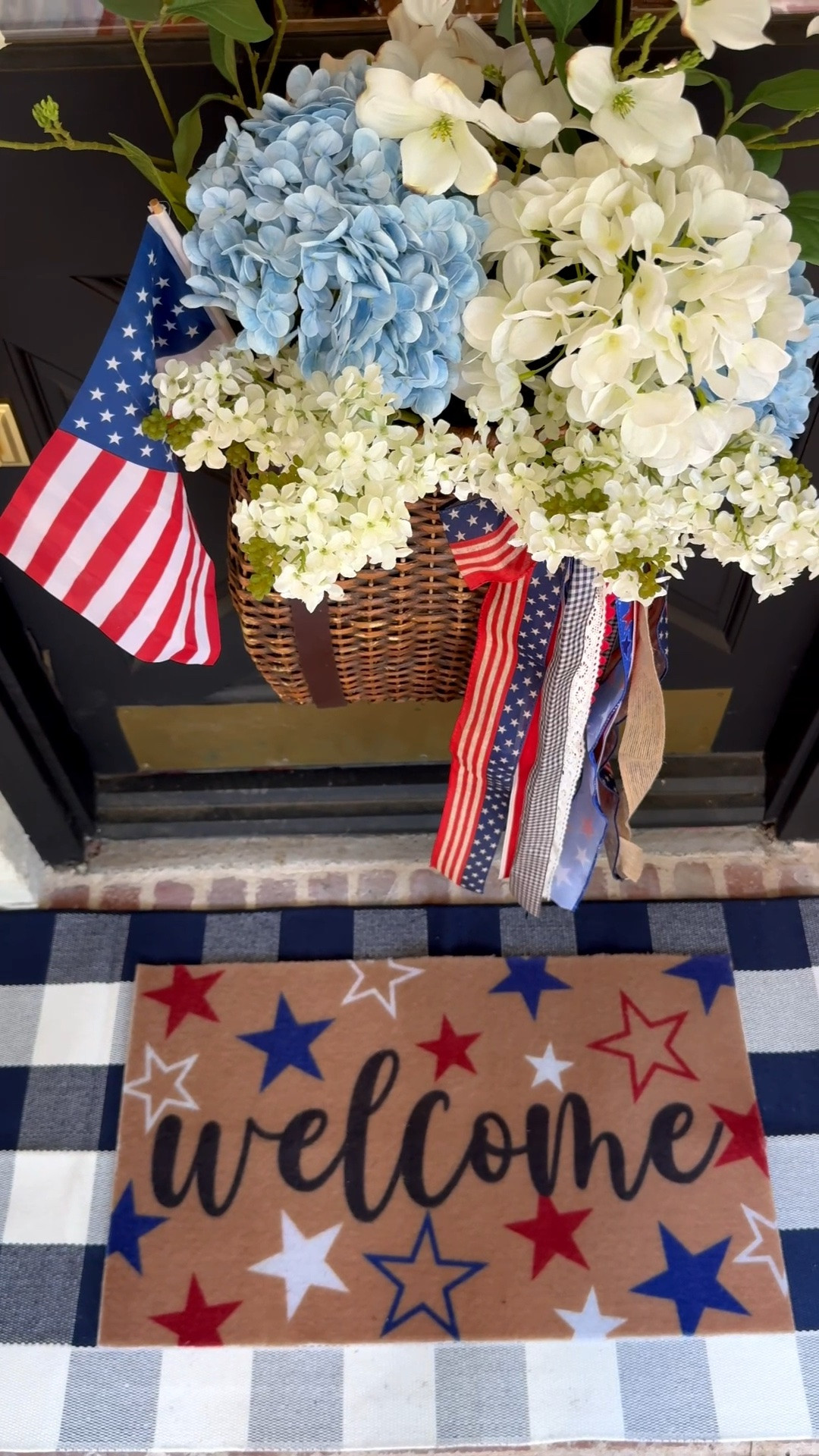 Decided it was a good day to get the front porch ready for the Fourth of July. I kept it pretty simple this year and made a couple of changes in my favorite hanging door basket. I added some white and blue hydrangea stems and a couple of taller artificial dogwood stems. This premade bow was the perfect touch. It simply clipped right onto the basket. I swapped out the mats for a navy gingham porch mat and added an extra layered mat. This coir mat is thinner than what I’m used to so I’m going to link a couple of options. Front porch inspo, Americana decor.

#LTKSeasonal #LTKHome #LTKSaleAlert