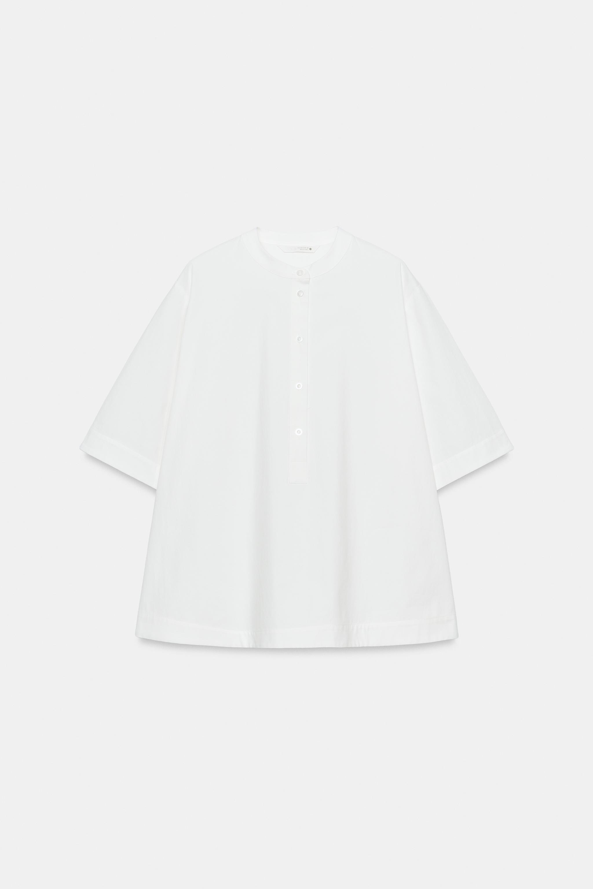 ZARA WOMAN COLLECTIONShirt made from a cotton blend yarn. Round neck and short sleeves. A-line he... | Zara US
