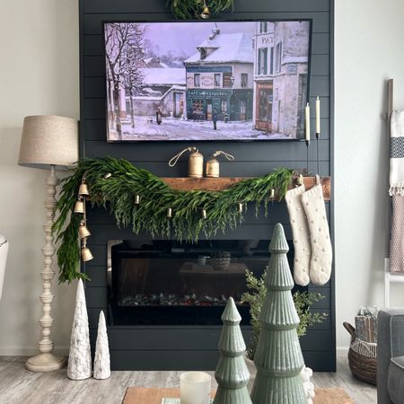 Fireplace mantle decorated for Christmas last year 🤩 These viral garlands & bells will sell out quick this year! 

#LTKHoliday #LTKhome #LTKSeasonal