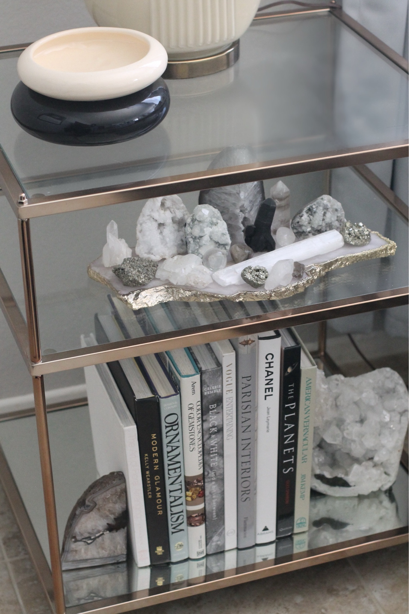 Brass side table decorated with crystals and books. Modern organic living room home decor ideas. 


#LTKFindsUnder50 #LTKHome #LTKFindsUnder100