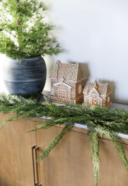 I LOVE the festive yet classic look of these faux gingerbread houses. They are a much cheaper alternative to the Pottery Barn ones and are perfect for dressing up a dining table, coffee table, console table, or mantle! #homedecor #ltkholiday #holidaydecor #christmasdecor #ltkhome #naturalchristmas #holidayhomedecor

#LTKhome #LTKHoliday #LTKSeasonal