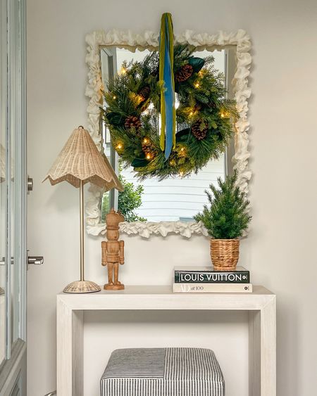 Our entryway was the first spot in our new home I decorated for Christmas! These holiday pieces were made for this spot. From the mixed evergreen pre-lit wreath, to the scalloped rattan lamps, to the potted tree, nutcracker and coffee table books - they look perfect with my white coral mirror and slim console table.

#ltkholiday #ltkhome #ltkseasonal #ltkunder50 #ltkunder100 #ltkgiftguide #ltksalealert #LTKsalealert #LTKHoliday #LTKhome

#LTKhome #LTKsalealert #LTKHoliday