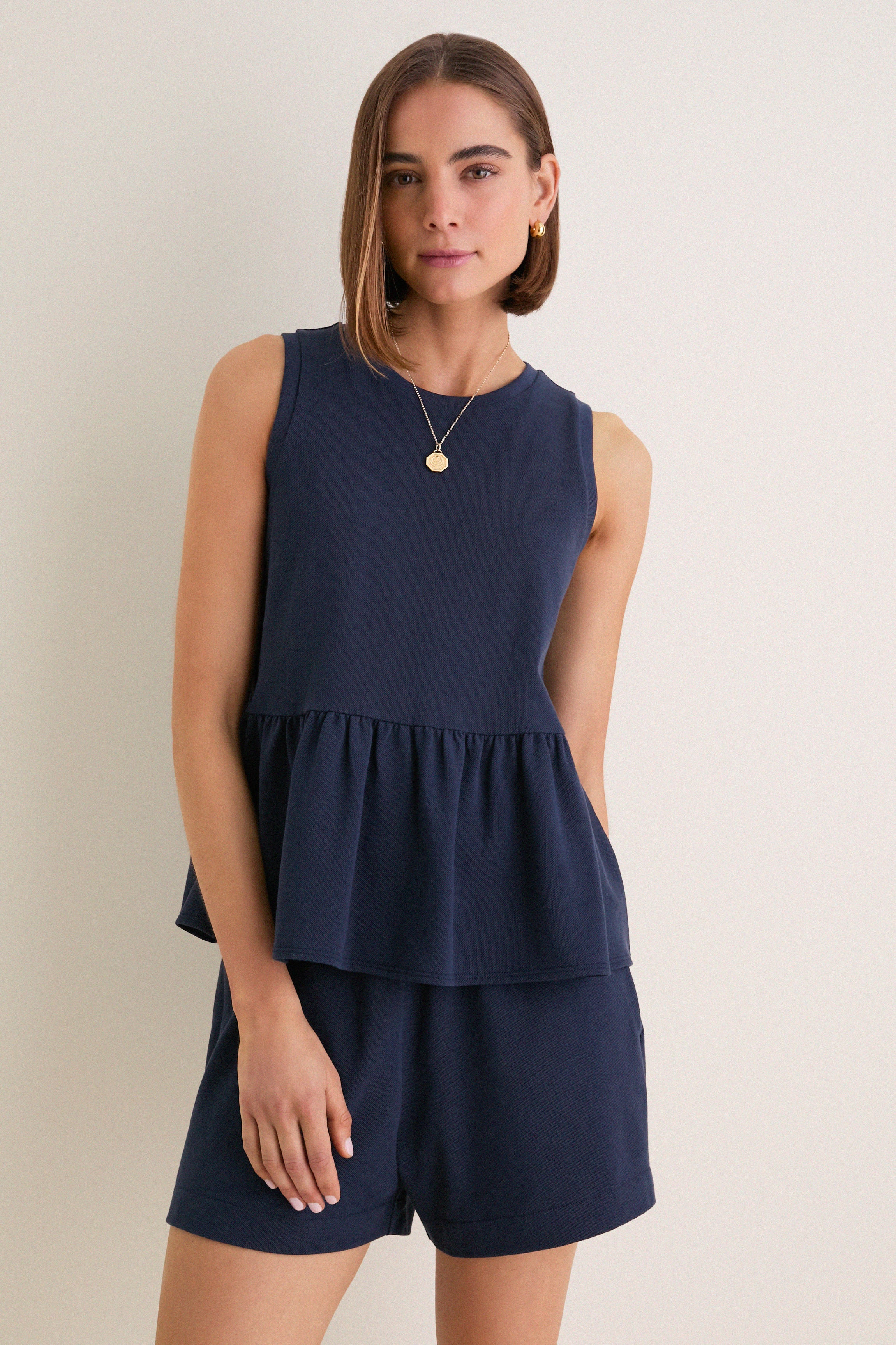 Navy Pique Mercer Peplum Top | Tuckernuck (US)