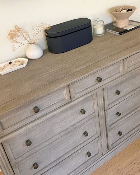 Dresser styling with jewelry tray Dyson faux branches candle and hair supplies dish 

#LTKhome