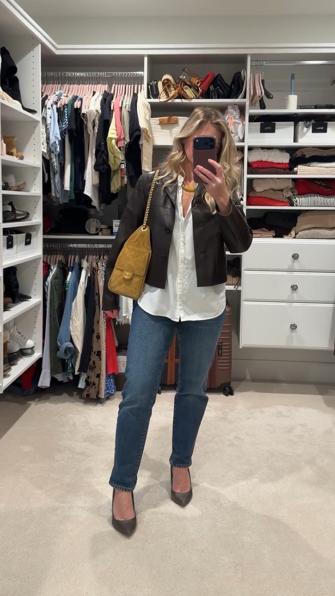 Chocolate brown layers + crisp white + my favorite Borrowed jeans = an easy spring uniform 🤎
Running between meetings today, so I leaned into elevated basics that move with me. The cropped faux leather jacket adds just enough edge, the cap-sleeve top keeps it fresh, and these @frame Borrowed jeans are forever on repeat (you already know I own them in multiple washes 😅). Finished with classic pumps, a pop of turquoise, and my Chanel 25 for a little everyday luxury.

Comfortable, classic, and pulled together, exactly how I like my workday looks. ✨

#LTKspringtrends #LTKPetite #LTKootd