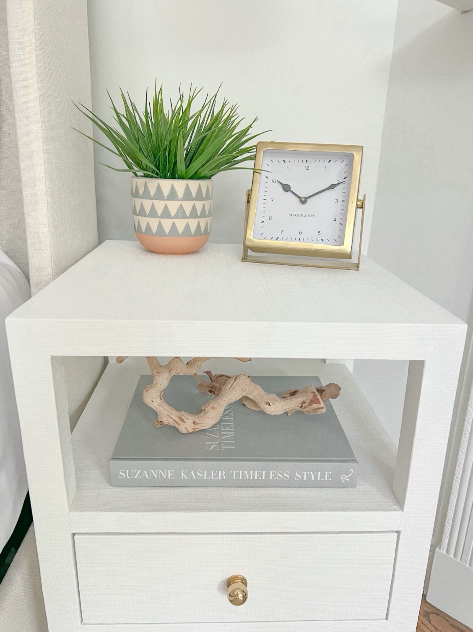 I keep my nightstand styling pretty simple in our primary bedroom!
- 
Coastal Nightstands, primary bedroom decor, coastal home decor, coastal styling, beach home decor, beach house style, coastal bedroom, coastal interior, coastal decorating, white nightstand, faux plant, gold clock, 2 drawer end table, end table, upholstered bed, blue and white geometric pot, planter, table clock, bedroom styling, neutral home, nightstand styling, nightstand decor, coastal nightstands, beach house bedroom, beach house nightstands, Amazon coffee table books, driftwood branch, shelf styling, Nightstands with shelf, nightstands with drawers, Wayfair nightstands, table clock, neutral coffee table book, narrow nightstands, small nightstands, bedroom ideas, beach house bedroom decor 

#LTKHome #LTKFindsUnder100 #LTKFindsUnder50