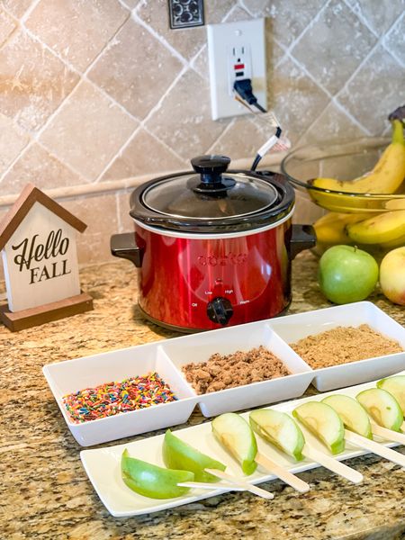 Made a quick caramel apple slice bar for my daughter for after school.  This is a great small snack or perfect to make for a party or gathering.  Melt caramels in a mini crockpot (with a very small amount of water).  Stick popsicle sticks into apple slices (cake pop sticks might look cuter but this is cheaper).  Fill a serving tray with your favorite toppings.

Dessert Bar 
Caramel Apples
Fall menu
Fall decor
Party ideas
serving ware
crockpot
snack
Kitchen 


#LTKSeasonal #LTKfamily #LTKhome