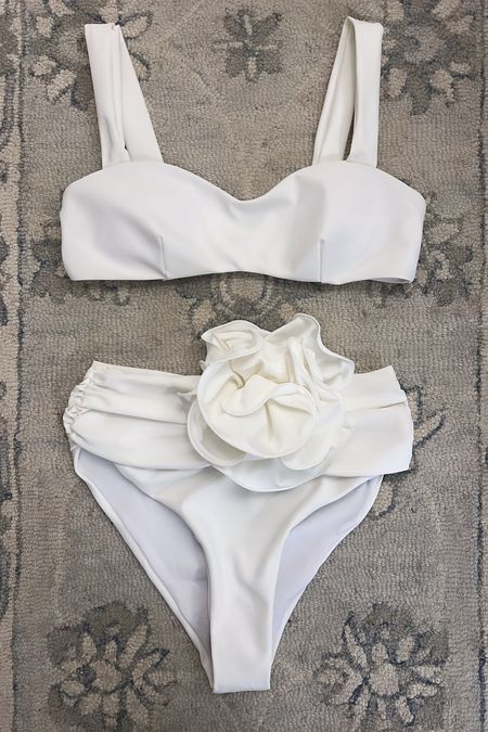 Designer, dupe swimsuit has arrived! All in all a great find at this price point. Only $20!

The flower on the bottom is permanent not removable like on the designer version. Smallest size was a S and the top is large on me so it may be a go back. 

#LTKswim #LTKover40 #LTKfindsunder50