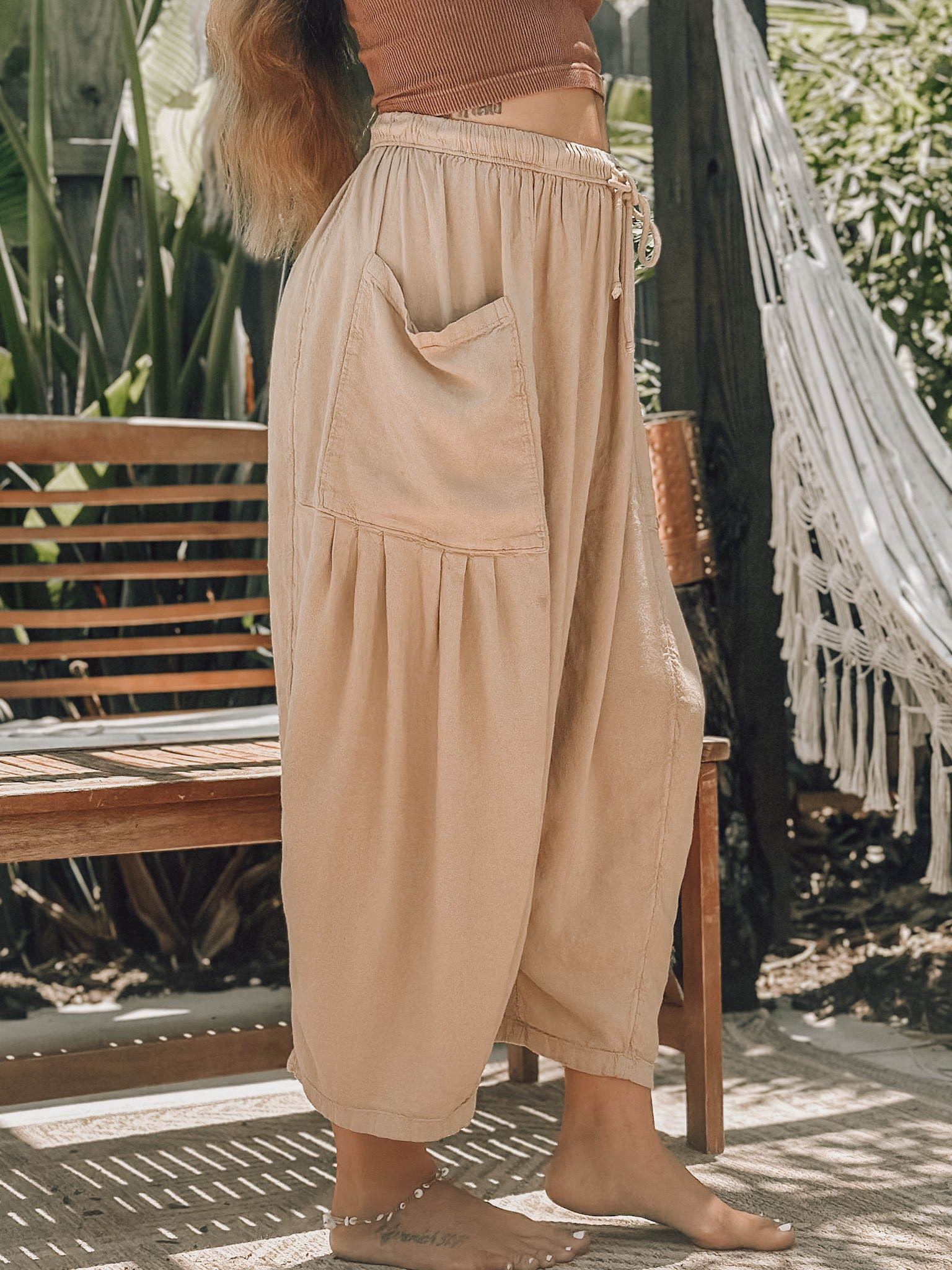 these are the ‘quinn pants’ in the color oat bran. i’m wearing an xs and cannot recommend these enough. they are so comfortable, and looks good just going to the beach, or out to lunch  