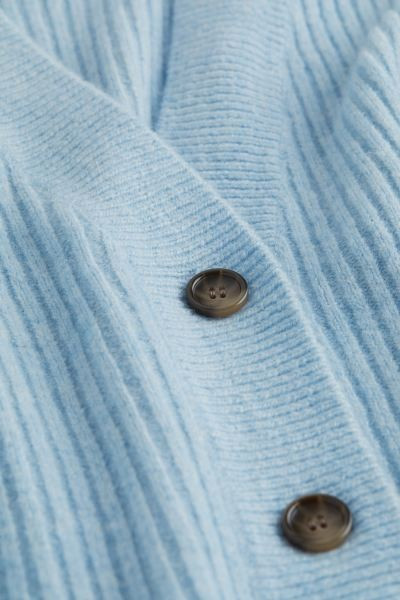 Soft, rib-knit cardigan with wool content. V-neck, buttons at front, dropped shoulders, and long ... | H&M (US + CA)