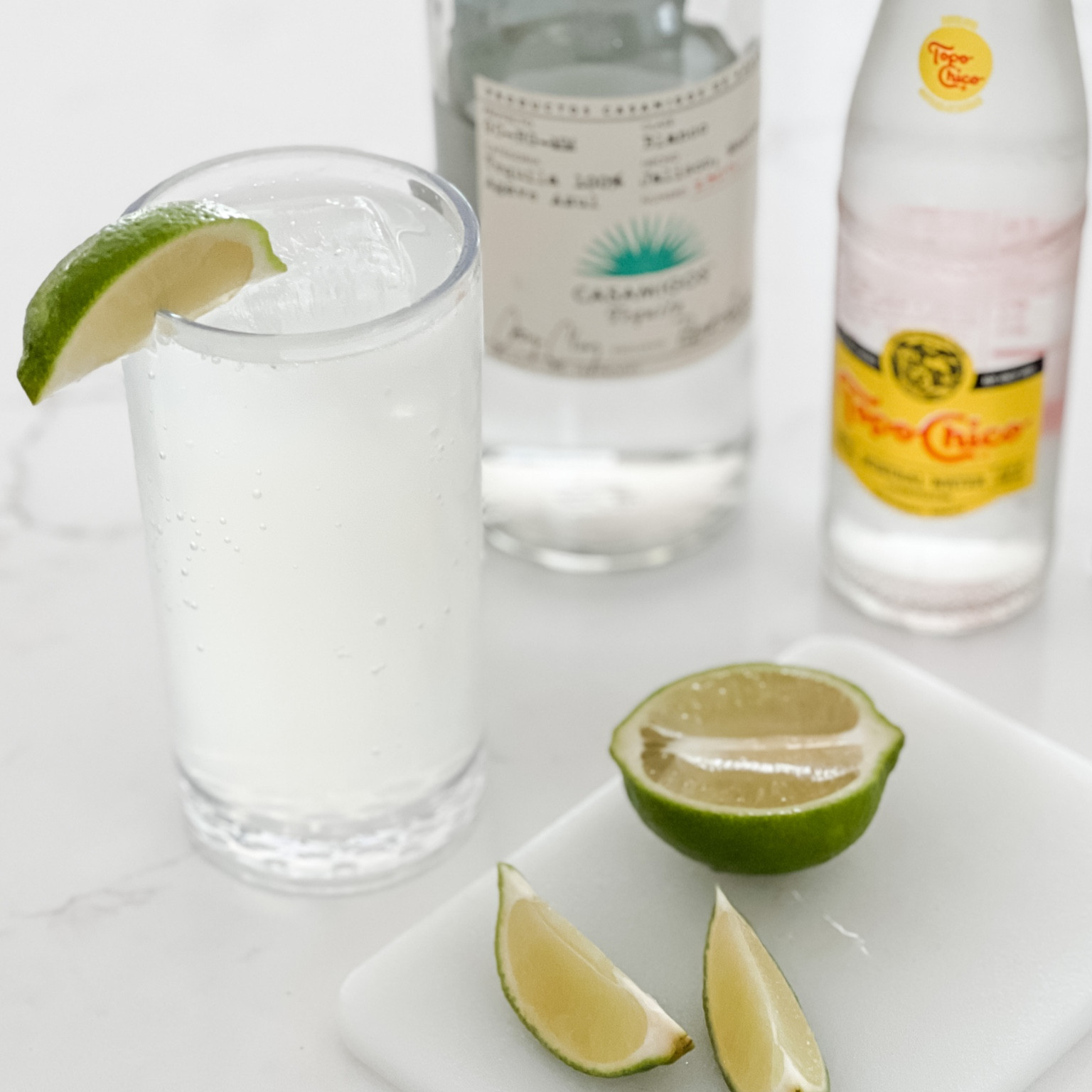 Ranch water is definitely going to be our cocktail of the summer! 
-  1.5 oz silver tequila
-  .75 oz lime juice
-  12 oz topo chico
Combine tequila and lime juice in a Collins glass filled with ice. Top with sparkling mineral water and stir gently to combine. Garnish with a lime wedge!

Linking our acrylic glassware that’s perfect for drinks on the patio! 

#LTKSeasonal #LTKhome