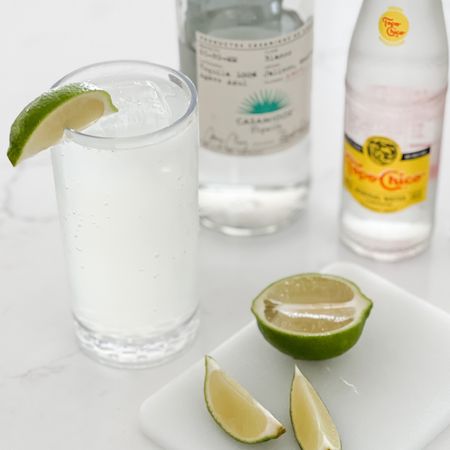 Ranch water is definitely going to be our cocktail of the summer! 
-  1.5 oz silver tequila
-  .75 oz lime juice
-  12 oz topo chico
Combine tequila and lime juice in a Collins glass filled with ice. Top with sparkling mineral water and stir gently to combine. Garnish with a lime wedge!

Linking our acrylic glassware that’s perfect for drinks on the patio! 

#LTKSeasonal #LTKhome