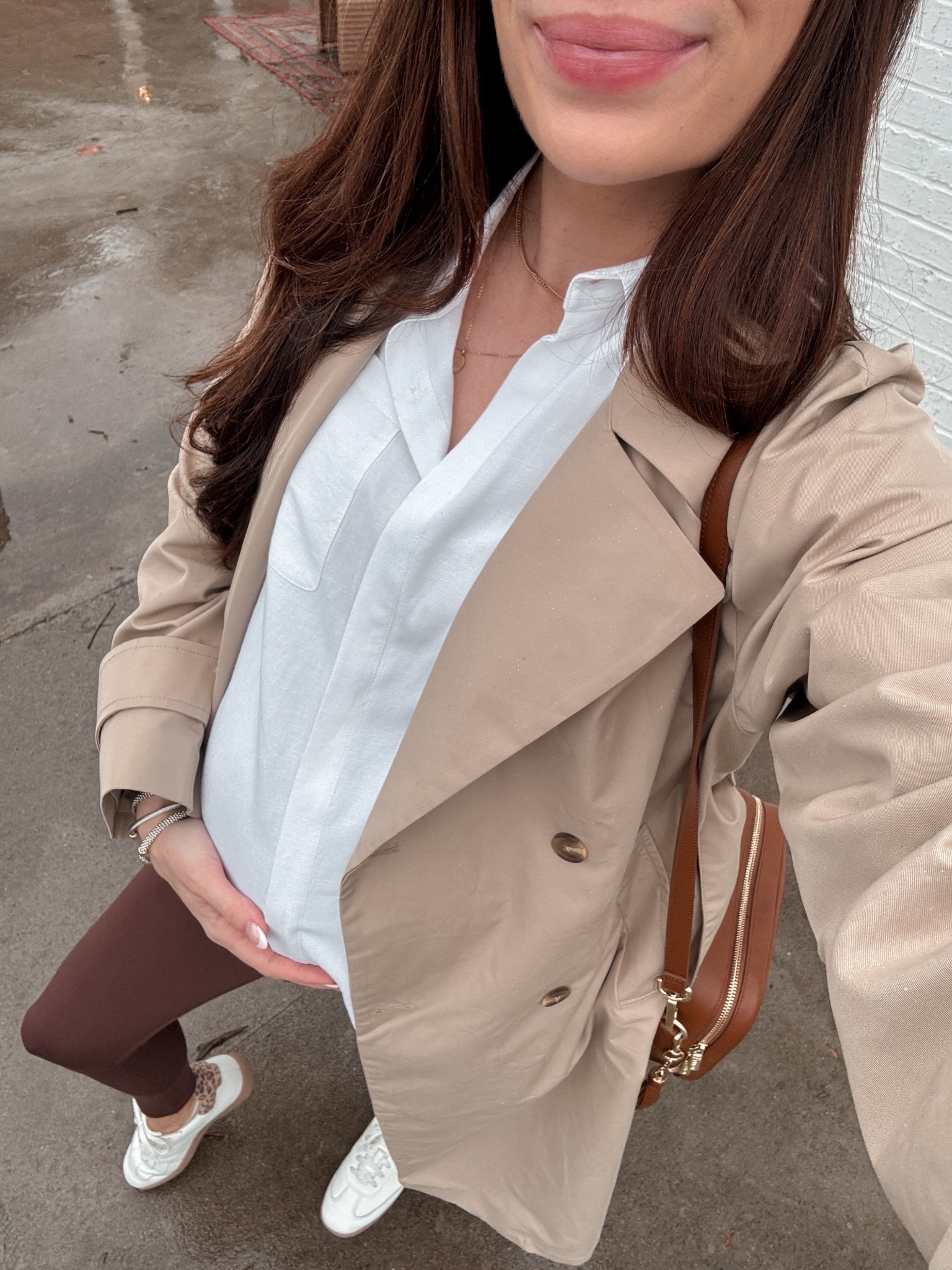 Easy rainy day outfit ☔️ ••• 37 weeks pregnant and ready to pop! I have a feeling this baby will be here sooner rather than later! 

• white linen button down (size 1)
• brown leggings (size XS — they run big)
• trench coat (size small regular)
• purse / diaper bag (IYKYK 😉) — old money leather 
• sneakers — size 9 (they fit 100% true to size and are soo comfortable since they’re podiatrist designed… perfect for everyday if you’re on your feet a lot)

#LTKmomlife #LTKBump #LTKWorkwear