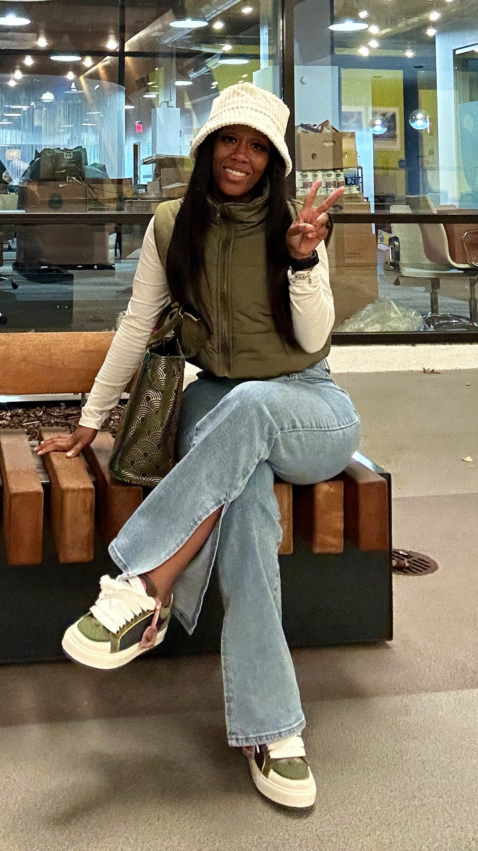 How to style Kurt Geiger Sneakers! I’m wearing a long sleeve white crop top, army green puffer vest, and light wash split hem mom jeans

#LTKSeasonal #LTKstyletip #LTKshoecrush
