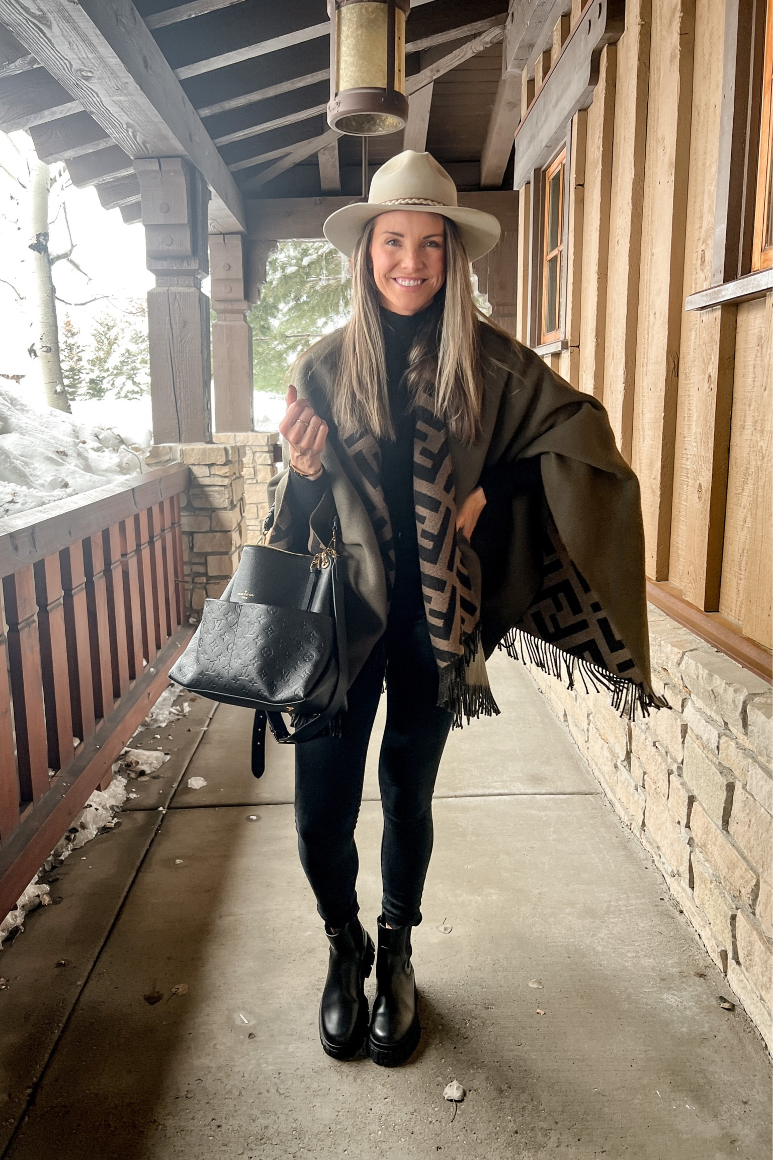 Last nights dinner outfit in Park City - poncho, wool shawl, Chelsea boot, black handbag

#LTKSeasonal #LTKstyletip #LTKFind