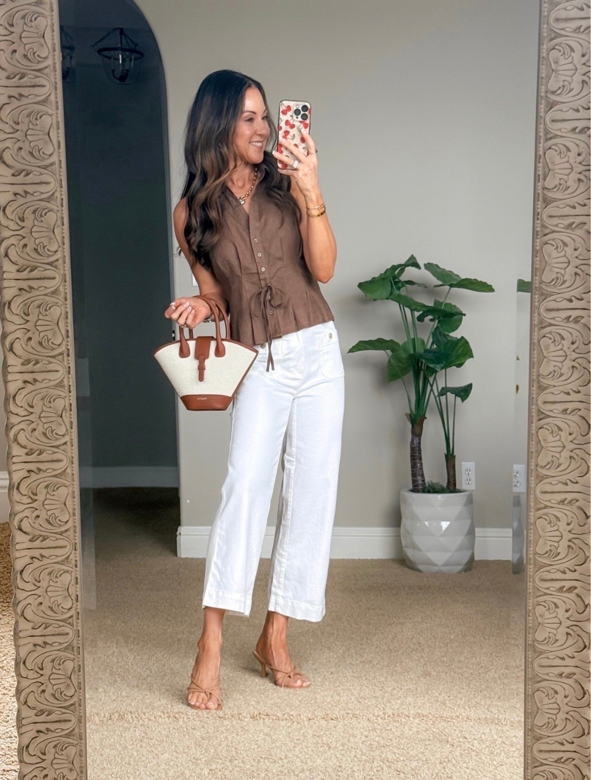 This neutral look is one of those outfits that feels effortlessly elevated. The linen blend tie front top paired with crisp white cropped jeans is such a chic combination for summer, and the woven handbag and strappy heels pull it all together beautifully. Perfect for brunch, date night, or any occasion where you want to look polished without sacrificing comfort.

Linen top, white cropped jeans, neutral summer outfit, elevated casual style, summer date night outfit, chic summer fashion, linen outfit, petite friendly fashion, woven handbag, capsule wardrobe, everyday style, EverydayHolly

#LTKootd #LTKOver40 #LTKPetite
