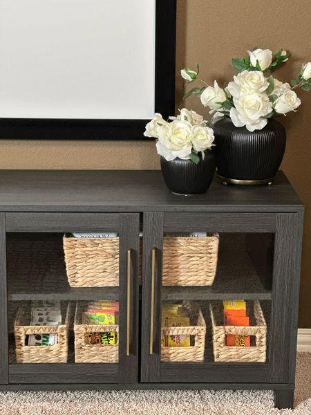 Media Room Ideas | A mini refresh with these affordable find cabinets.

I used two cabinets to fill the entire wall. Baskets filled on one side with all of the movie night essentials. Water, popcorn, candy and blankets. The other cabinet holds our home workout basics. Weights, towels, mats and more.

Walmart finds
Console
Media cabinet 
Storage cabinett

#LTKfamily #LTKhome