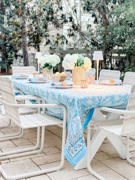 Outdoor dining table, patio chairs, patio, dining table, Serena and Lily, classic furniture, traditional patio furniture, wicker patio furniture, rattan, patio furniture, white, outdoor dining table, blue and white tablecloth, cordless table, lamps, rattan, hurricanes, tablecloth, summer table, setting

#LTKhome #LTKSeasonal