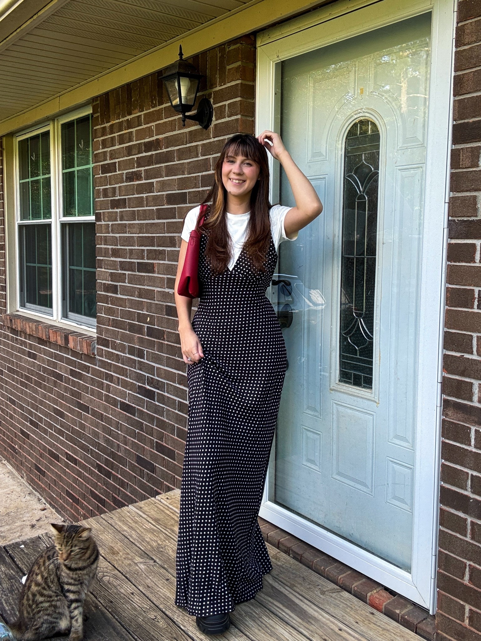 Black and white polka dot maxi dress modest fall outfit with a pop of red bag! 

#LTKStyleTip #LTKItBag #LTKFindsUnder50
