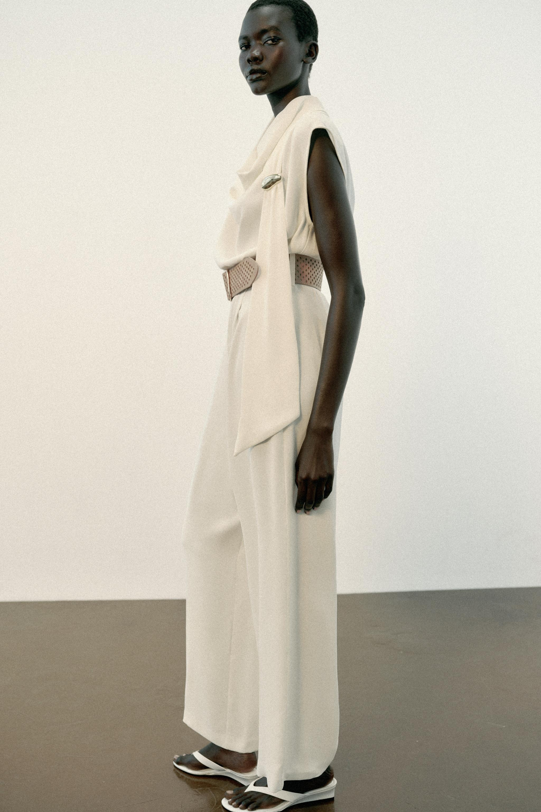 Flowing neck jumpsuit in a scarf-print fabric with gold-tone appliqu\u00e9. Featuring a belt and ... | Zara UK