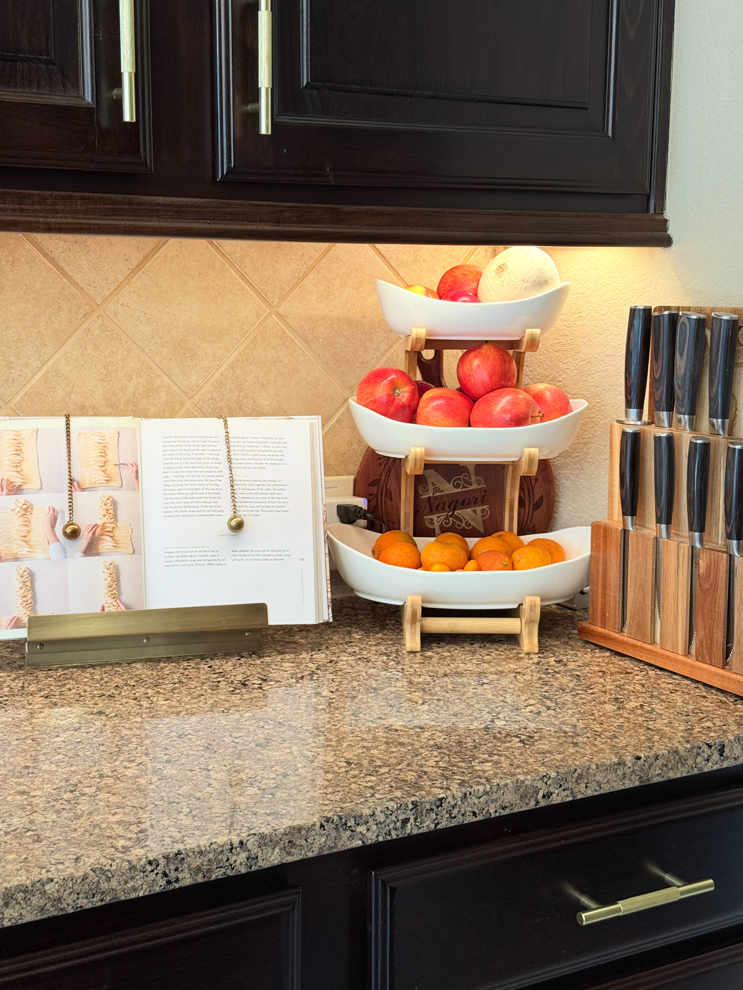 This three-tier fruit stand is such a functional way to add vertical storage and a pop of color to the kitchen counters. Pairing it with a brass cookbook stand keeps the space feeling organized and ready for a fresh afternoon of baking. 

 #LTKmomlife #LTKfoodie #LTKHome