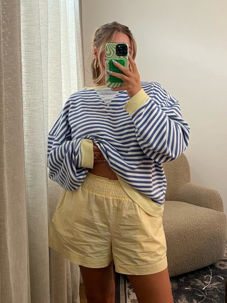 Size down in sweatshirt to a small! Shorts are on sale for $12?!?!? Bought a Large but just purchased another color in a M. Stick with true size they are super stretchy and these are a bit too loose! Cute affordable boxer style!! 