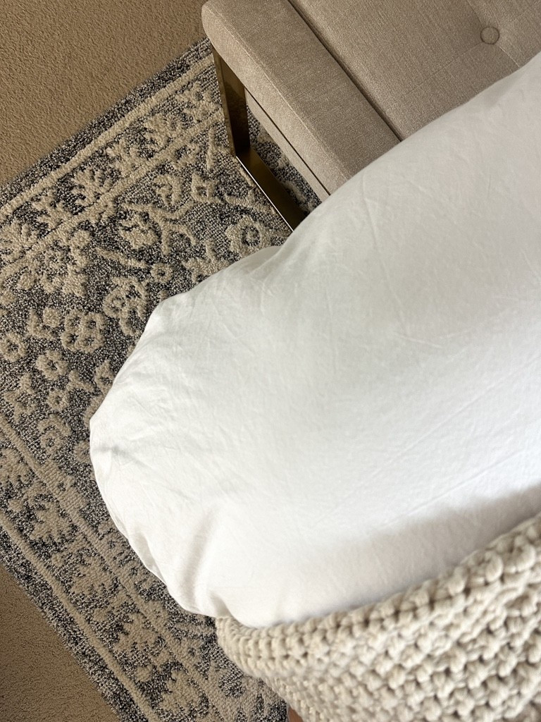 Warm transitional bedroom details 

Duvet
Bench
Rug
Blanket 