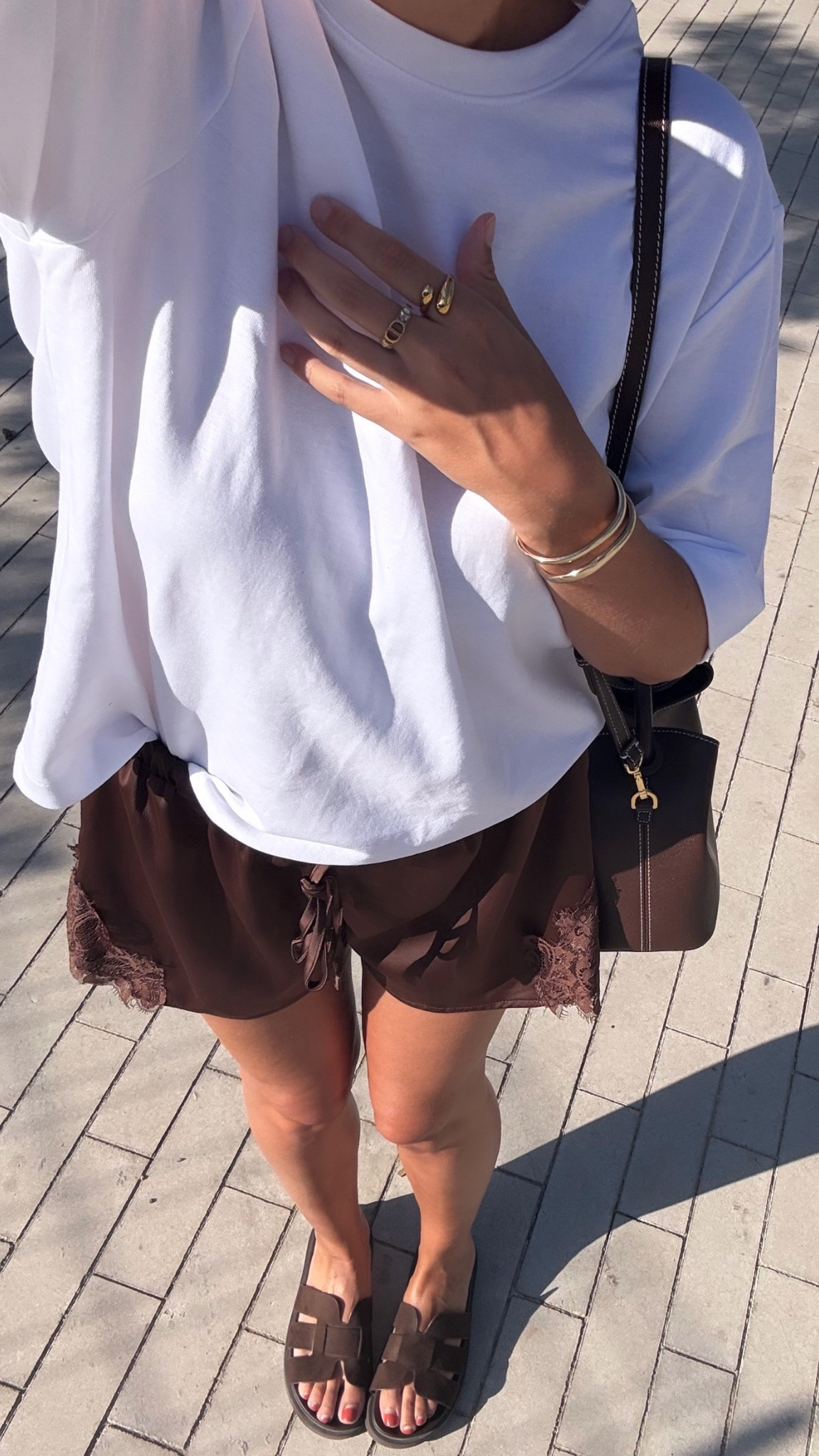 Chocolate satin lace shorts🍫
Use code CS20 on Elleme bags 
Tags: oversized white body tshirt h&m suede sandals Hermes dupe leather holiday vacation chic women’s style city break date night Dubai Barcelona dinner with the girls capsule wardrobee

#LTKstyletip #LTKsummer