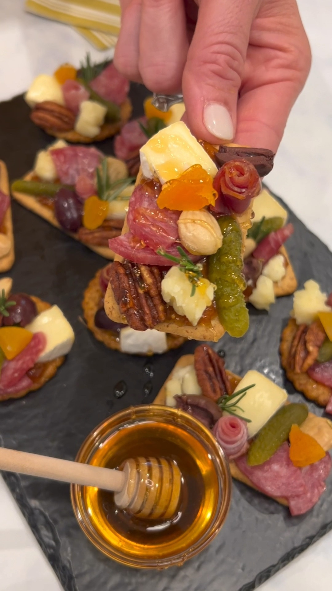 Charcuterie Board Cracker Bites combine all your favorite flavors from a cheese board into a two-bite appetizer that everyone will love! ❤️ 

#LTKParties