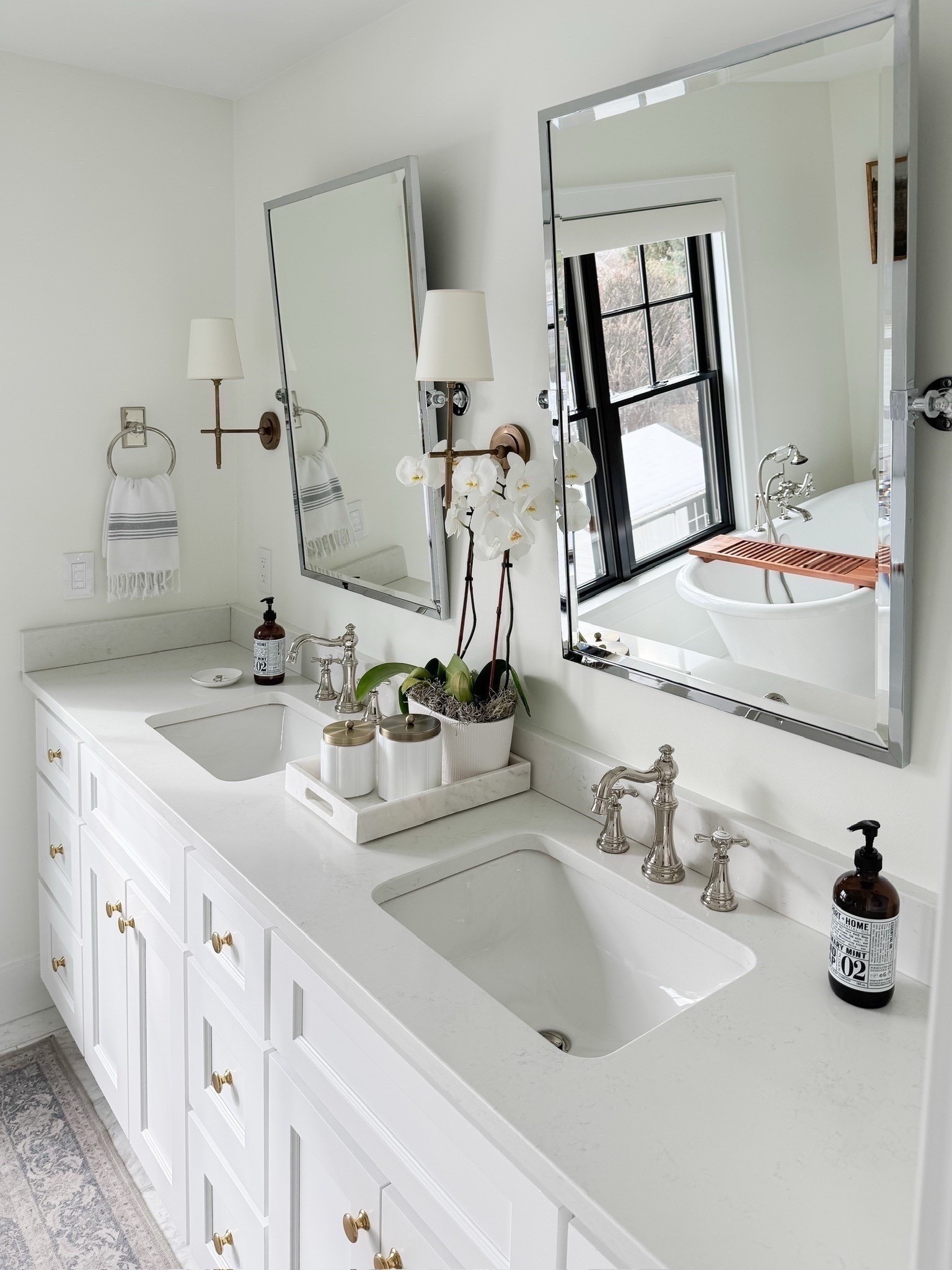 Shop my spa like white brass and marble bathroom. I am linking similar marble from Wayfair. My vanity was custom, but I am linking similar one. I used to mix metals in the space with polished nickel plumbing and brass sconces and knobs. My vintage style runner is washable and I’ve had it for almost 5 years now.

#LTKmomlife #LTKHome