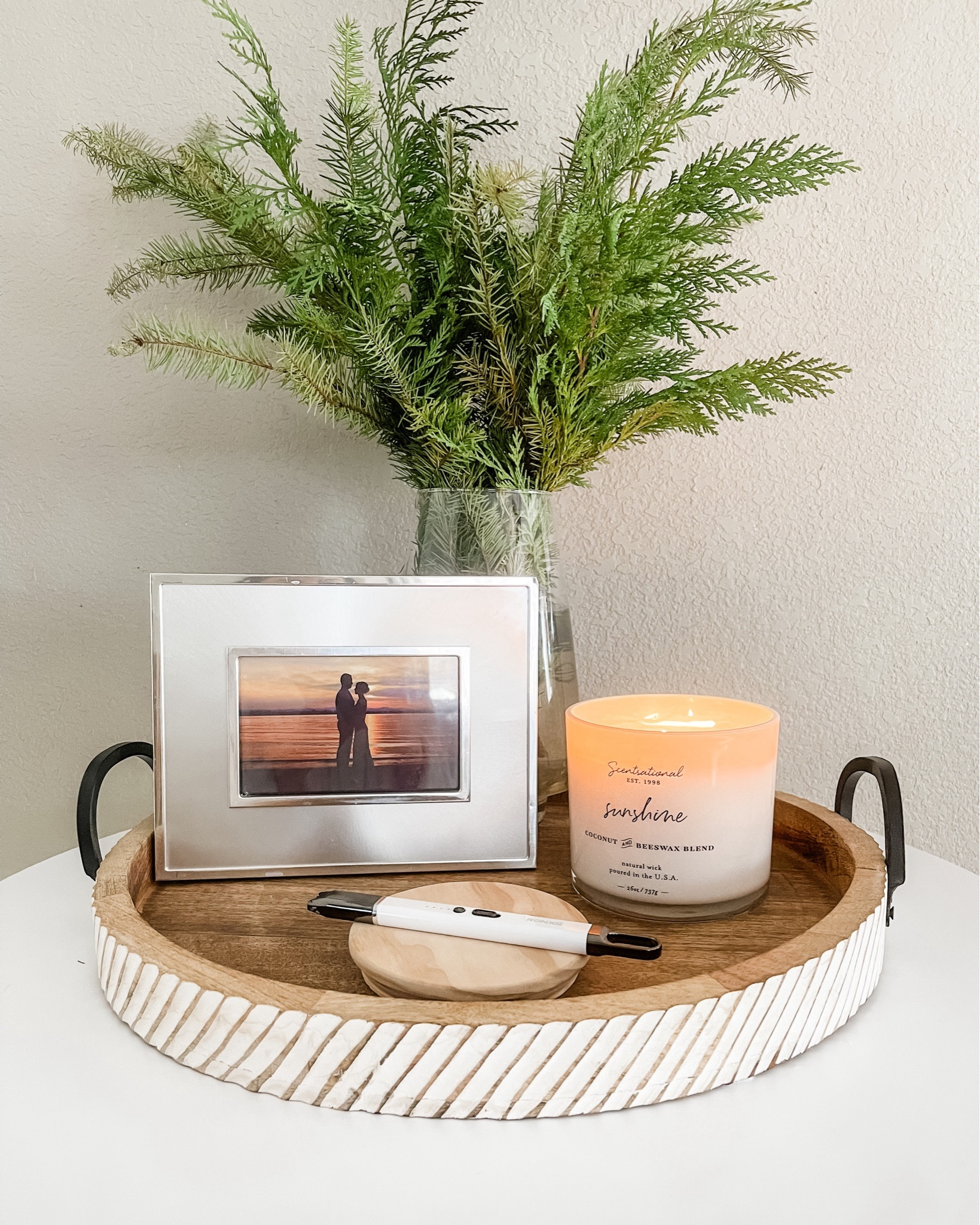 To me, lighting a candle is therapeutic so I have one burning during most of my wake hours right next to our sunset photo. With fire being one of earth’s natural elements, signifying life and energy, it’s no surprise the candle awakens me and inspires me to recharge with meditation, yoga, journaling, or organizing.  

This one has warm vibes like — well, the name of it—sunshine. It smells mostly like freshly cleaned linen but has slight notes of citrus. It’s made from a natural beeswax and coconut wax blend, has a natural wick, and is made in the USA. I’m using my rechargeable electric lighter that’s convenient and protects my hands from the flame.  Unwind and recharge with your own. 

#tray  #ltkstyletip liketoknowit #ltkstyle #ltkhome #ltkootd #decor #candle #sunshine #recharge #life #energy #love #spirit #meditation #table decor 

#LTKGiftGuide #LTKfindsunder50 #LTKhome
