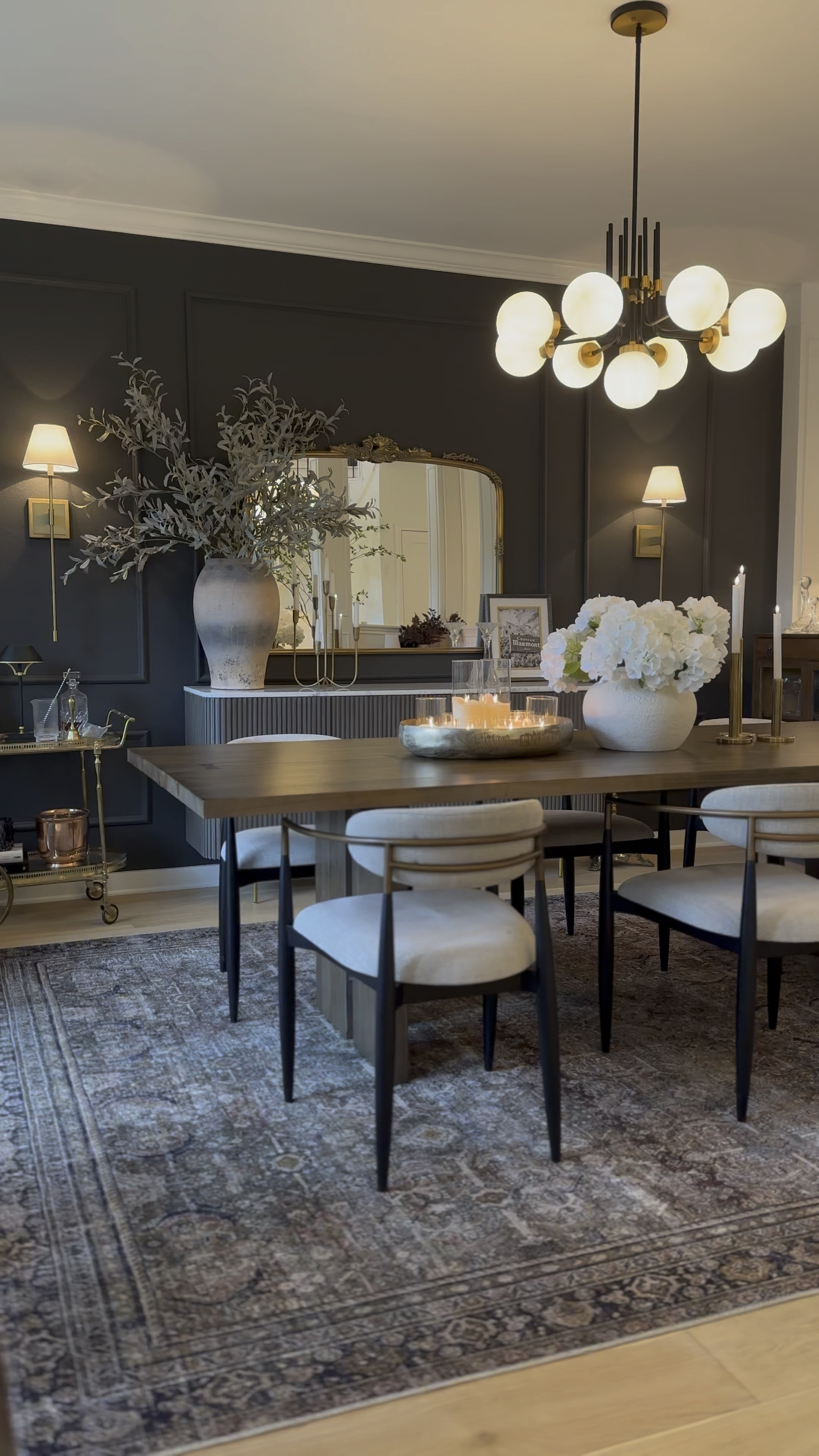 Moody dining room views ☺️ My rug is the Olive/Charcoal in a 9x12! Wall color is Iron Ore by SW.

#LTKSaleAlert #LTKHome #LTKStyleTip