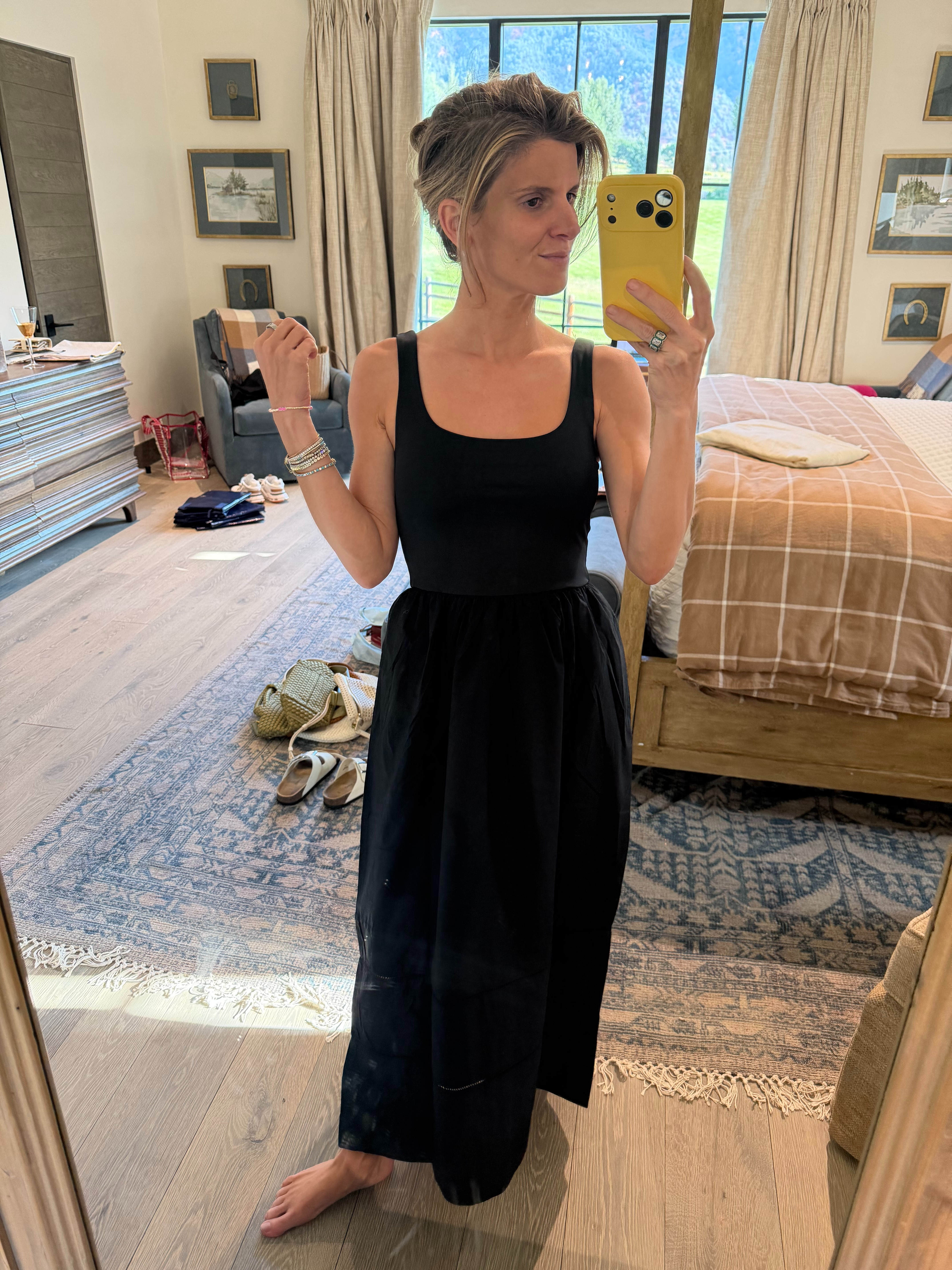 Easy black throw on dress under $150 with pockets! Wearing XS!